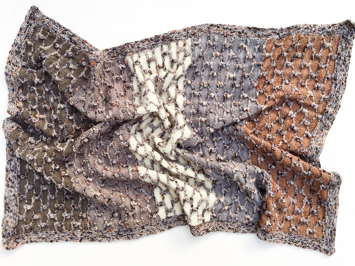 Hand knit baby blanket in Cowgirlblues Merino wool in neutral colours