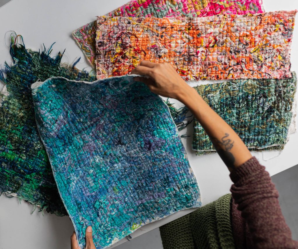 The Cowgirlblues team checks over the sustainable scrappy fabric which is made from textile production offcuts.