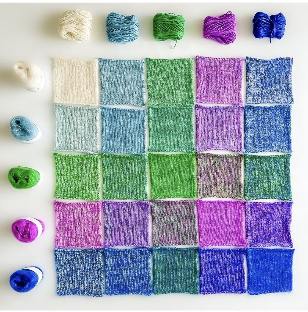 Illustrating colour arling with a grid of square swatches. The Cowgirlblues Merino Twist colours are arranged along the top, and the Cowgirlblues kidsilk colours down the left side, with the swatches in a central grid.